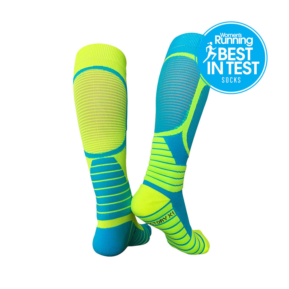 Compression socks for running and recovery. Back view, yellow and blue with details around the foot and calf muscles.